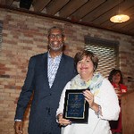 Mrs. Rita Cooper receiving the Professional Support Staff accomodation from Dean Grant